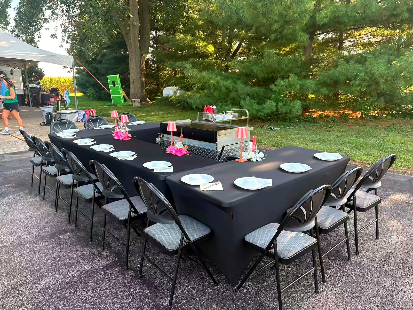 Backyard hibachi party setup in Bend with long table